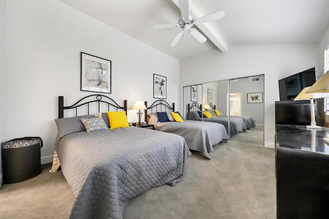 bedroom featuring carpet floors, lofted ceiling with beams, ceiling fan, and a closet