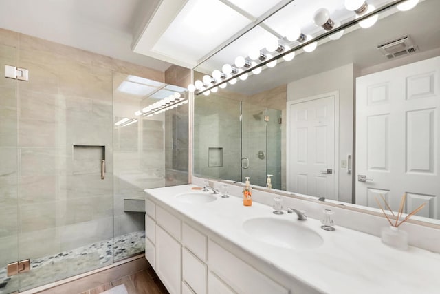 bathroom with vanity and an enclosed shower