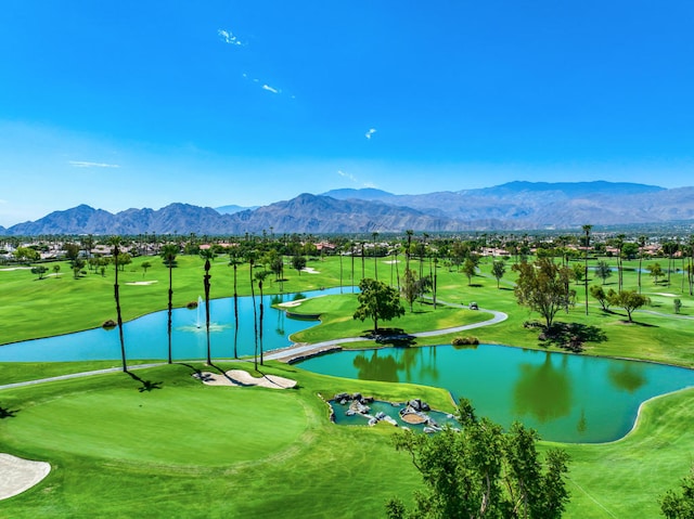 view of property's community featuring a water and mountain view