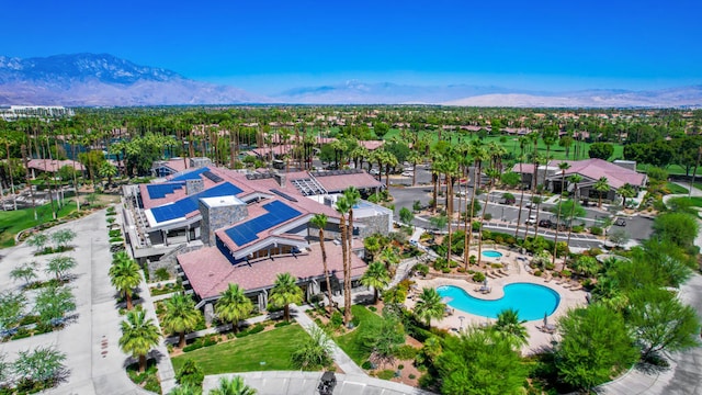 birds eye view of property with a mountain view