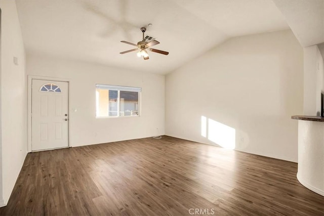 unfurnished living room featuring ceiling fan, lofted ceiling, and dark wood-type flooring