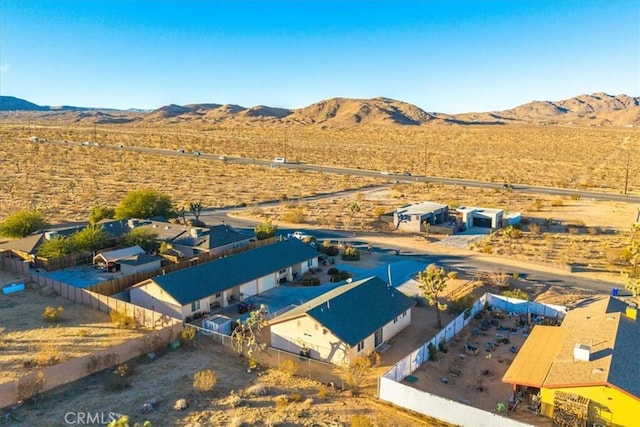 birds eye view of property featuring a mountain view