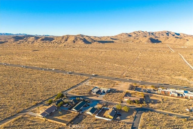 drone / aerial view featuring a mountain view