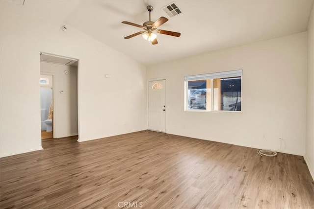 unfurnished room featuring ceiling fan, lofted ceiling, and hardwood / wood-style flooring