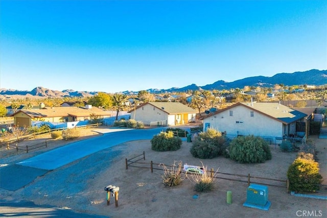 birds eye view of property with a mountain view