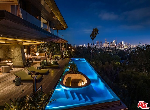 pool at night with a deck