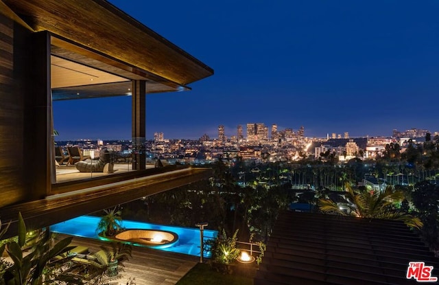 view of balcony at twilight