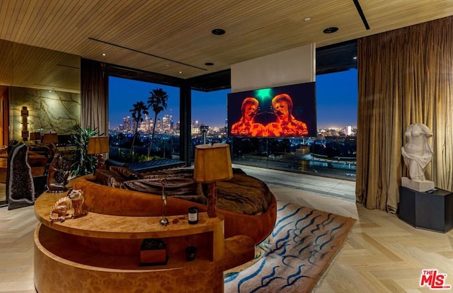 home theater room featuring wood ceiling and light parquet flooring