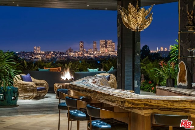 view of patio with an outdoor bar