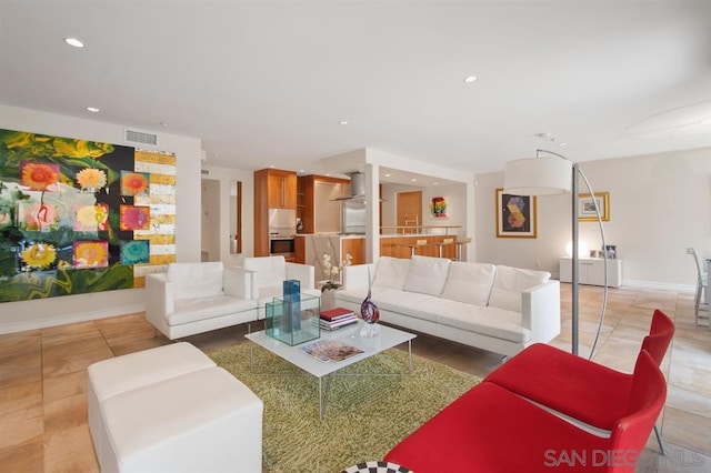 living room with tile patterned flooring