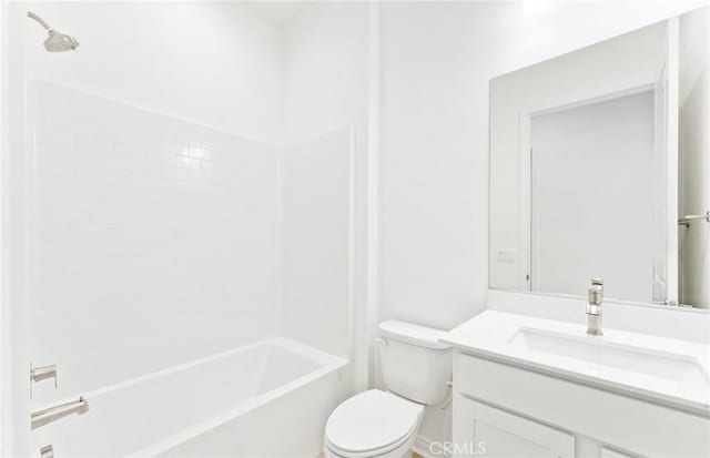 full bathroom featuring vanity, washtub / shower combination, and toilet