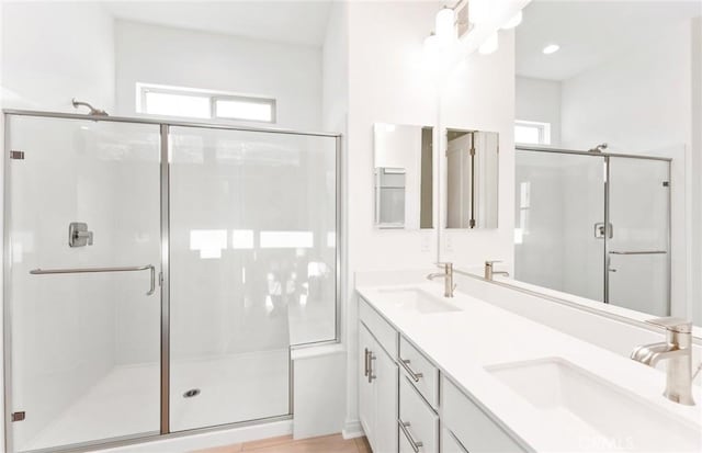 bathroom with vanity and walk in shower