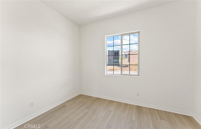 unfurnished room with light hardwood / wood-style floors