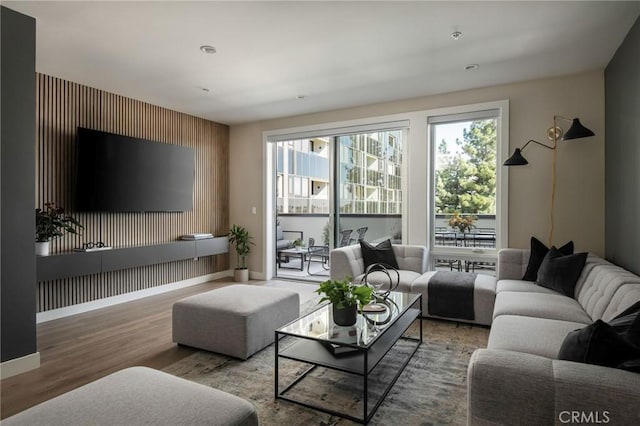 380 Cordova St Unit 506, Pasadena, CA 91101 - living area with wood finished floors, baseboards, and an accent wall