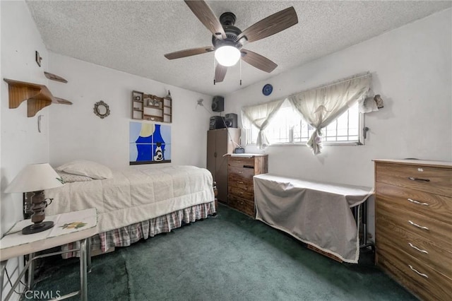 carpeted bedroom with a textured ceiling and ceiling fan