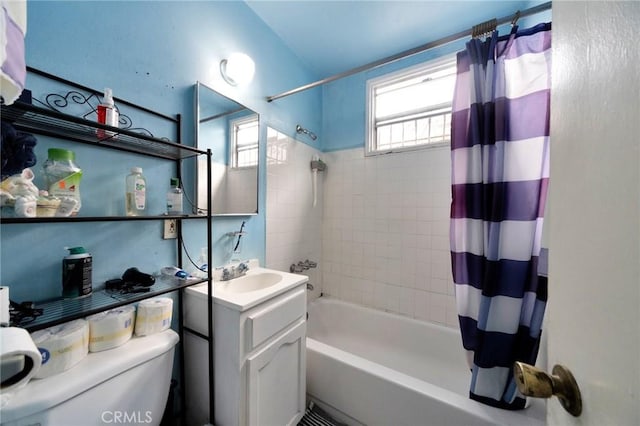 full bathroom with vanity, shower / bathtub combination with curtain, and toilet