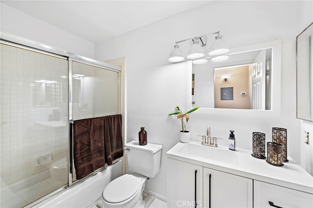 full bathroom with shower / bath combination with glass door, vanity, and toilet