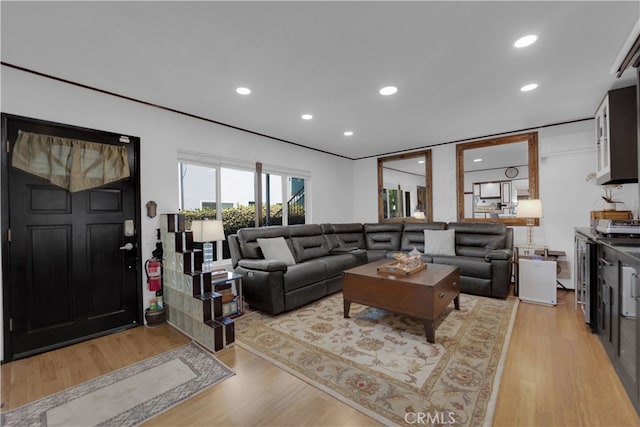 living room with light hardwood / wood-style flooring