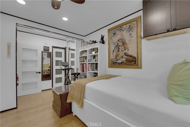 bedroom featuring light wood-type flooring and ceiling fan