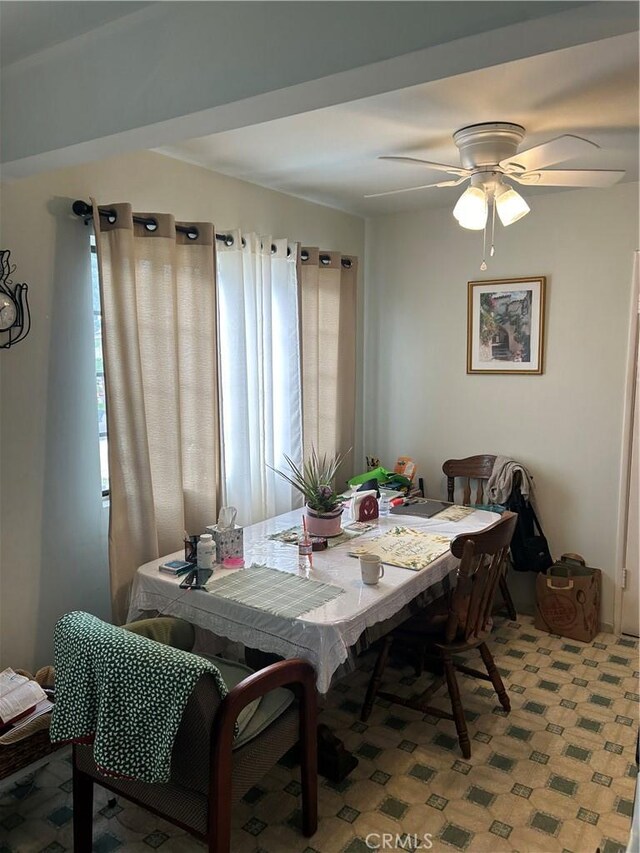 dining room featuring ceiling fan