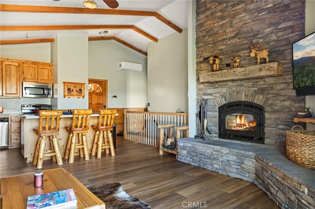 30008 Hickory Dr, Lake Arrowhead, CA 92321 - living room featuring beam ceiling, dark wood finished floors, a fireplace, high vaulted ceiling, and a wall mounted AC