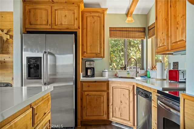 30008 Hickory Dr, Lake Arrowhead, CA 92321 - kitchen featuring appliances with stainless steel finishes, light countertops, and beamed ceiling