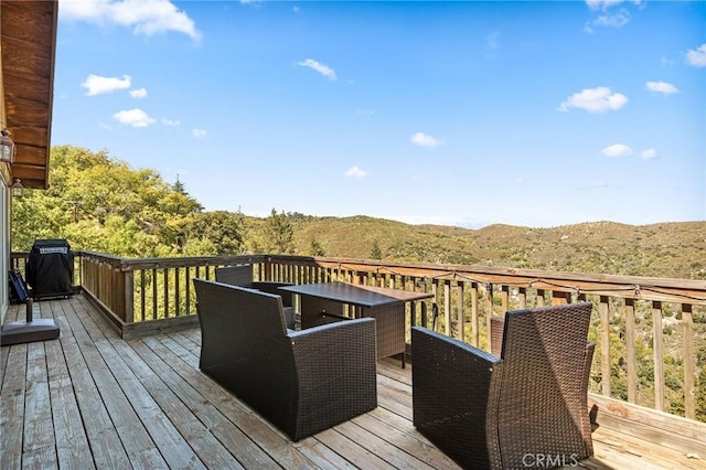 30008 Hickory Dr, Lake Arrowhead, CA 92321 - wooden terrace featuring outdoor dining area, grilling area, and a mountain view