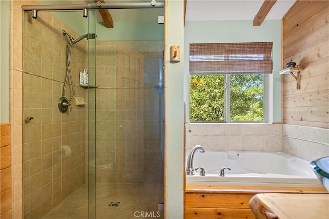 bathroom featuring wooden walls and shower with separate bathtub