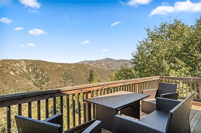 30008 Hickory Dr, Lake Arrowhead, CA 92321 - wooden terrace featuring a mountain view and outdoor dining area