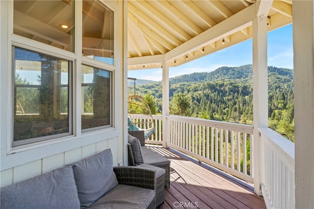 wooden deck with a mountain view