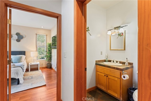 bathroom with vanity and hardwood / wood-style floors