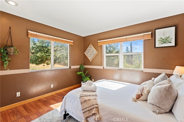 bedroom with wood-type flooring