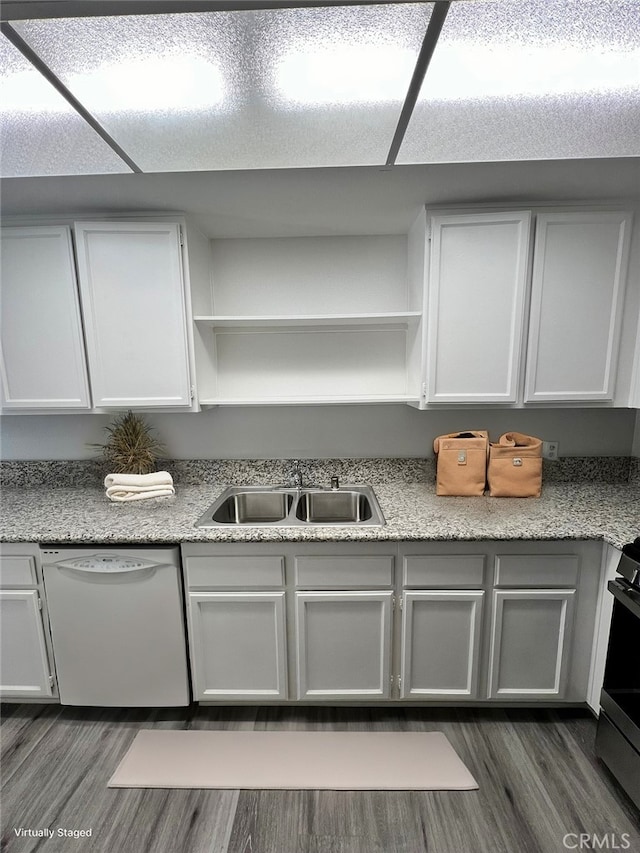 kitchen featuring dark hardwood / wood-style floors, dishwasher, white cabinets, and sink