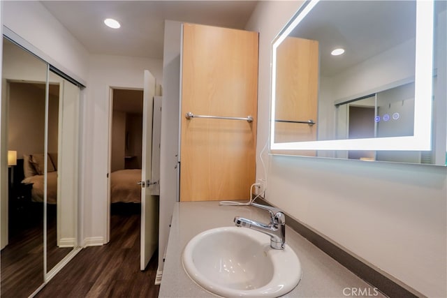 bathroom featuring vanity and hardwood / wood-style floors