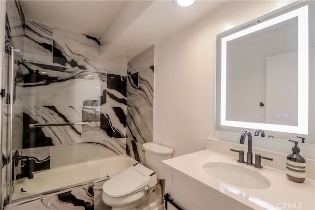 full bathroom with vanity, toilet, and tiled shower / bath