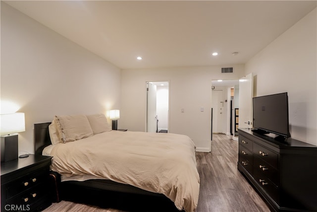 bedroom featuring hardwood / wood-style floors