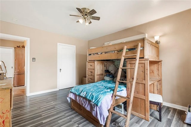 bedroom featuring ceiling fan and dark hardwood / wood-style flooring