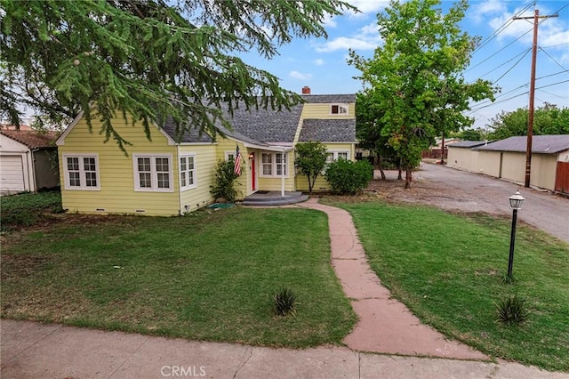 view of front of home with a front yard