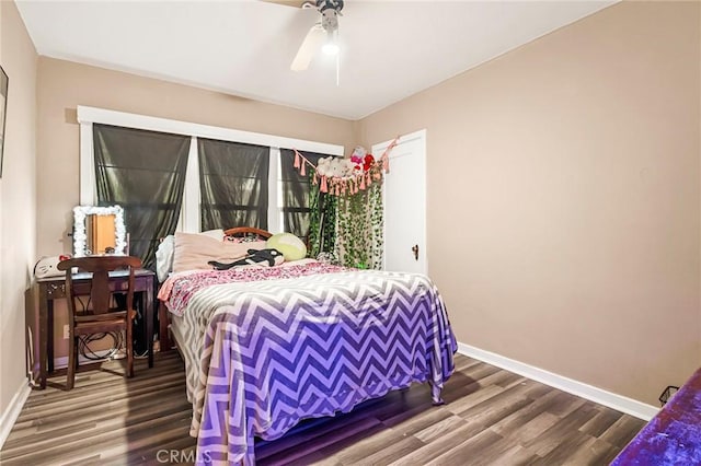 bedroom with hardwood / wood-style floors and ceiling fan