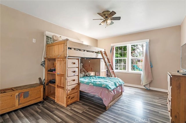 bedroom with ceiling fan and dark hardwood / wood-style floors