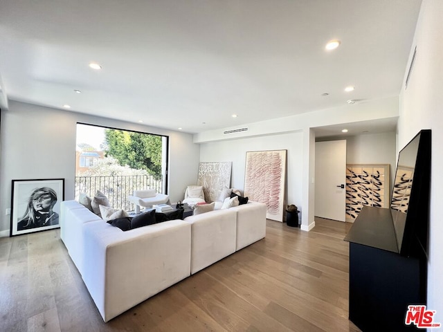 living room with light hardwood / wood-style floors