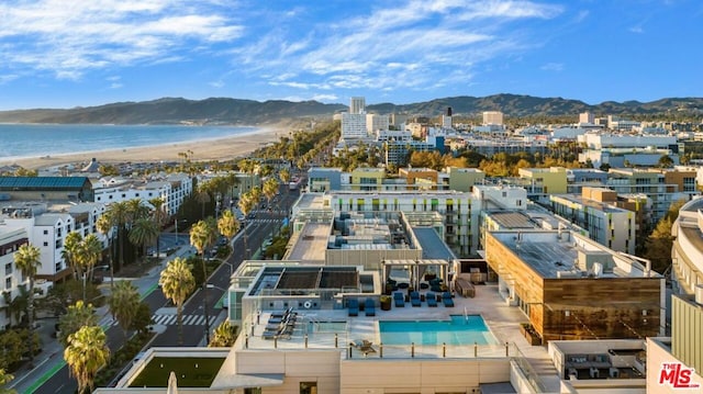 bird's eye view with a water and mountain view