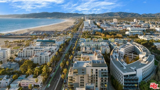 bird's eye view featuring a beach view and a water and mountain view