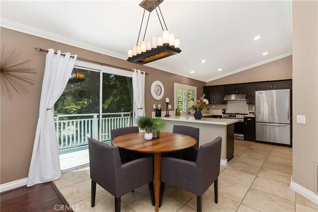 dining space with vaulted ceiling, ornamental molding, and light tile patterned flooring