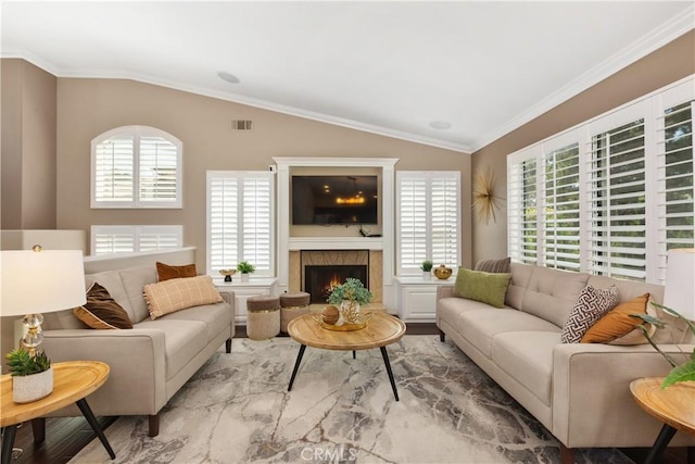 living room with crown molding and lofted ceiling