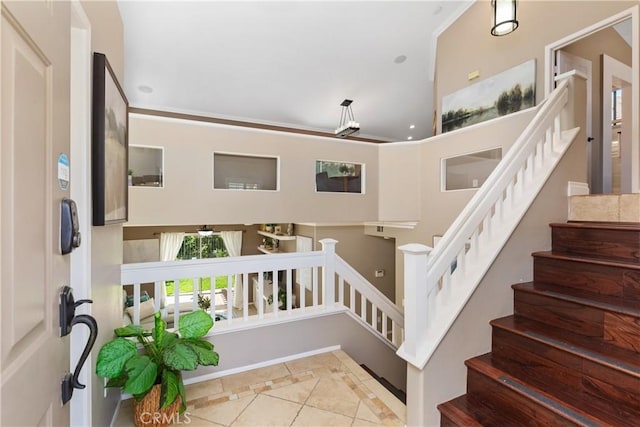 stairs featuring tile patterned flooring