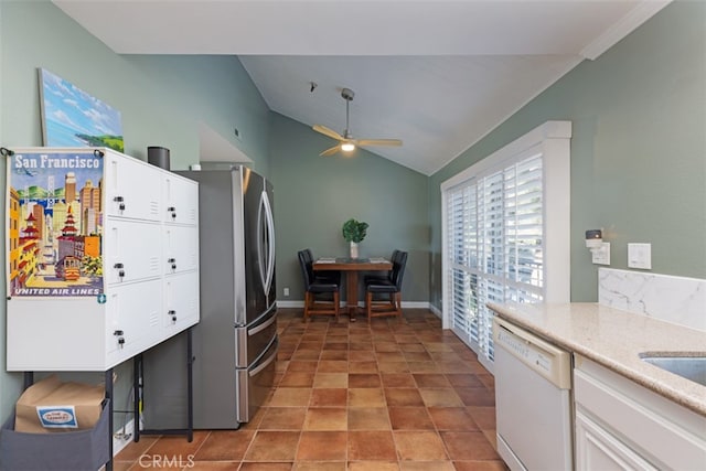 kitchen featuring dishwasher, lofted ceiling, white cabinetry, ceiling fan, and stainless steel fridge