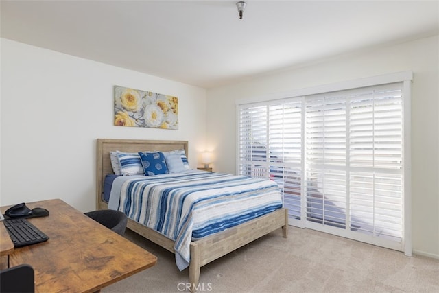 bedroom featuring light colored carpet