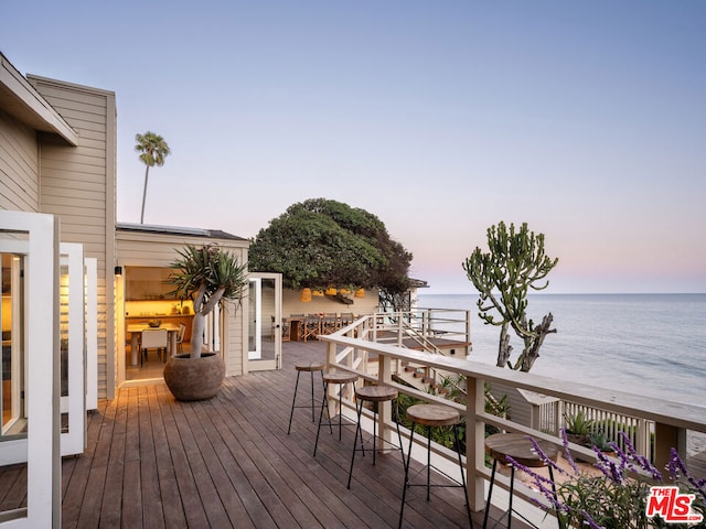 deck at dusk with a water view