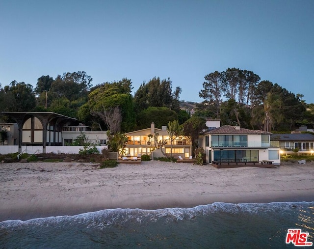 back of house featuring a water view